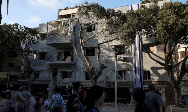 People gather at an impact site following Iran’s strike on Israel, amid the Iran-Israel conflict, in Haifa, Israel, June 22, 2025. REUTERS People gather at an impact site following Iran’s strike on Israel, amid the Iran-Israel conflict, in Haifa, Israel, June 22, 2025. REUTERS