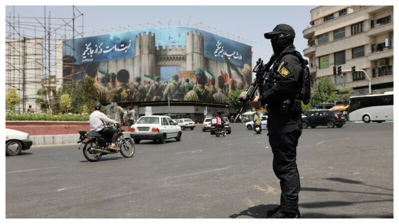 A security guard stands on a street, during early hours of ceasefire, in Tehran, Iran, June 24, 2025. Majid Asgaripour/WANA (West Asia News Agency) via REUTERS A security guard stands on a street, during early hours of ceasefire, in Tehran, Iran, June 24, 2025. Majid Asgaripour/WANA (West Asia News Agency) via REUTERS