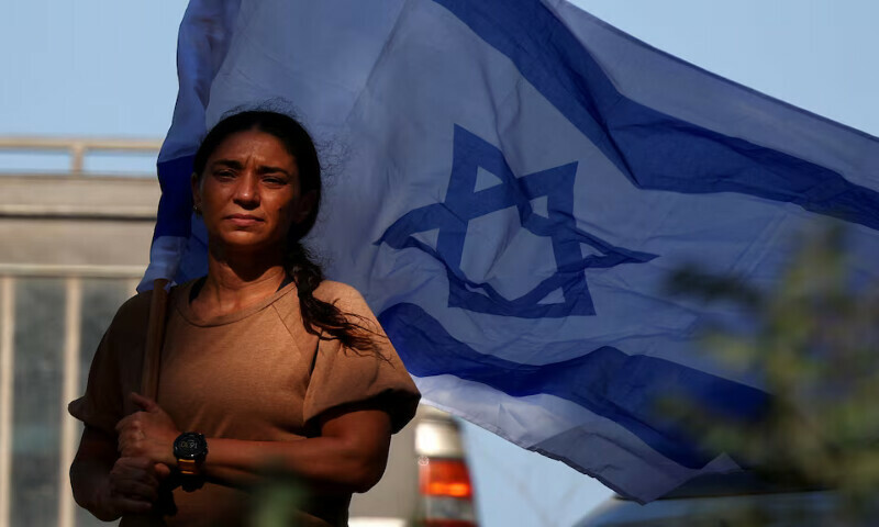 A mourner holds an Israeli flag, ahead of the funeral of an Israeli soldier who was killed amid the ongoing conflict in Gaza, in Misgav, Israel, on Wednesday. – Reuters A mourner holds an Israeli flag, ahead of the funeral of an Israeli soldier who was killed amid the ongoing conflict in Gaza, in Misgav, Israel, on Wednesday. – Reuters