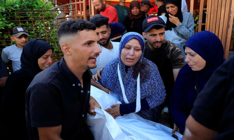 Mourners attend the funeral of Palestinians killed in Israeli air strikes on tents sheltering displaced people, at Nasser hospital, in Khan Younis, southern Gaza Strip, on Thursday. – Reuters Mourners attend the funeral of Palestinians killed in Israeli air strikes on tents sheltering displaced people, at Nasser hospital, in Khan Younis, southern Gaza Strip, on Thursday. – Reuters