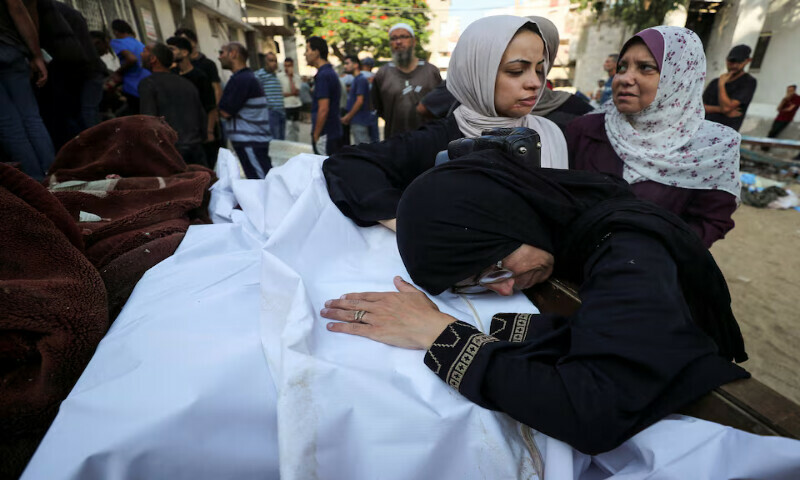 Mourners attend the funeral of Palestinians killed in an Israeli air strike on a house, at Al Shifa Hospital in Gaza City, on Thursday. – Reuters Mourners attend the funeral of Palestinians killed in an Israeli air strike on a house, at Al Shifa Hospital in Gaza City, on Thursday. – Reuters