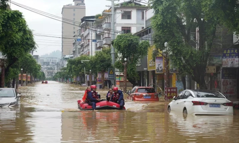 Rescue workers evacuate flood-affected residents with a boat in Rongjiang county, Guizhou province, China June 24, 2025. China Daily via REUTERS Rescue workers evacuate flood-affected residents with a boat in Rongjiang county, Guizhou province, China June 24, 2025. China Daily via REUTERS