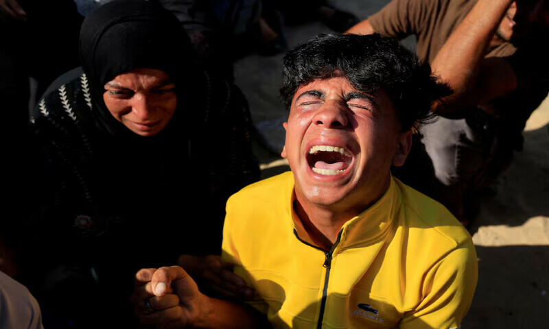 Mourners react during the funeral of Palestinians killed in an overnight Israeli strike on a tent at Nasser Hospital in Khan Younis, southern Gaza Strip, on Sunday. – Reuters Mourners react during the funeral of Palestinians killed in an overnight Israeli strike on a tent at Nasser Hospital in Khan Younis, southern Gaza Strip, on Sunday. – Reuters