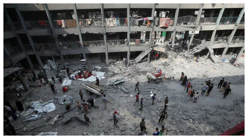 Palestinians inspect the damage at an UNRWA school sheltering displaced people that was hit in an Israeli air strike on Sunday, in Gaza City, June 30, 2025. REUTERS Palestinians inspect the damage at an UNRWA school sheltering displaced people that was hit in an Israeli air strike on Sunday, in Gaza City, June 30, 2025. REUTERS