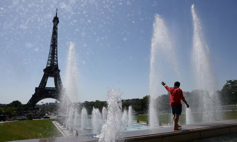 A tourist cools off in the Trocadero Fountain next to the Eiffel Tower as an early summer heatwave hits Paris, France, on Tuesday. – Reuters A tourist cools off in the Trocadero Fountain next to the Eiffel Tower as an early summer heatwave hits Paris, France, on Tuesday. – Reuters