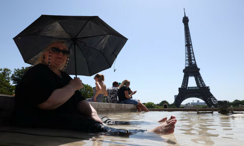 Svetlana from Russia cools off in the Trocadero Fountain next to the Eiffel Tower as an early summer heatwave hits Paris, France, on Tuesday. – Reuters Svetlana from Russia cools off in the Trocadero Fountain next to the Eiffel Tower as an early summer heatwave hits Paris, France, on Tuesday. – Reuters