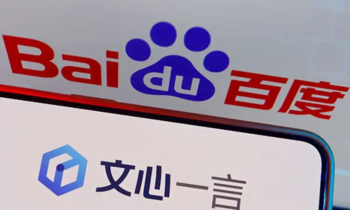 The logo of Baidu’s AI chatbot Ernie Bot is displayed near a screen showing the Baidu logo, in this illustration picture taken June 28, 2023. Reuters The logo of Baidu’s AI chatbot Ernie Bot is displayed near a screen showing the Baidu logo, in this illustration picture taken June 28, 2023. Reuters