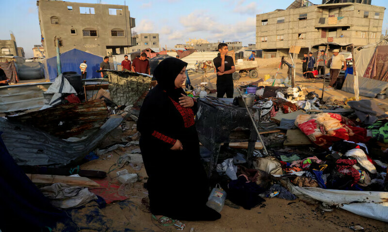 Palestinians inspect the damage at the site of an Israeli air strike on a tent sheltering displaced people in Khan Younis, southern Gaza Strip, on Wednesday. – Reuters Palestinians inspect the damage at the site of an Israeli air strike on a tent sheltering displaced people in Khan Younis, southern Gaza Strip, on Wednesday. – Reuters