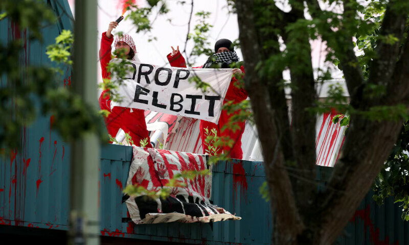 Protesters from “Palestine Action” demonstrate on the roof of Guardtech Group in Brandon, Suffolk, Britain. – Reuters Protesters from “Palestine Action” demonstrate on the roof of Guardtech Group in Brandon, Suffolk, Britain. – Reuters