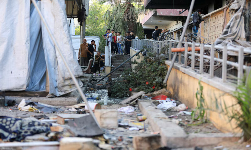 Palestinians inspect the damage at a school sheltering displaced people following an Israeli airstrike in Gaza City on Thursday. – Reuters Palestinians inspect the damage at a school sheltering displaced people following an Israeli airstrike in Gaza City on Thursday. – Reuters