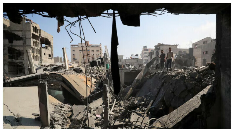 Palestinians inspect the site of Thursday’s Israeli strike that damaged and destroyed residential buildings, at Shati (Beach) refugee camp, in Gaza City, July 4, 2025. REUTERS