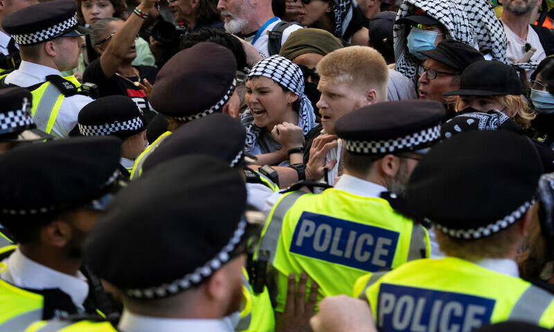 Supporters of the Palestine Action group scuffle with police in London, Britain. – Reuters