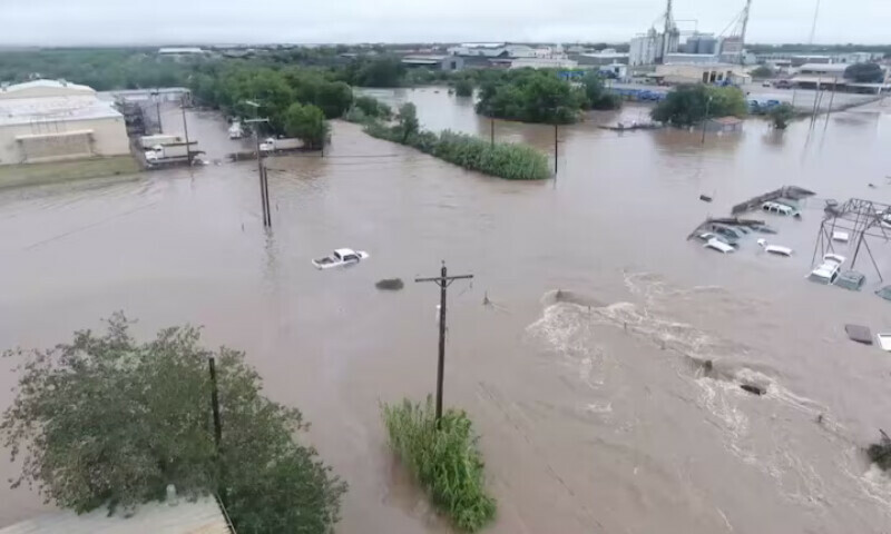 A drone view of vehicles partially submerged in flood water following torrential rains that unleashed flash floods along the Guadalupe River in San Angelo, Texas, US. – Reuters