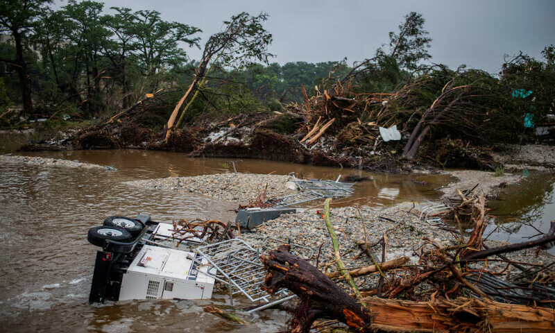 Uprooted trees sit after deadly flooding in Kerrville, Texas, US. – Reuters