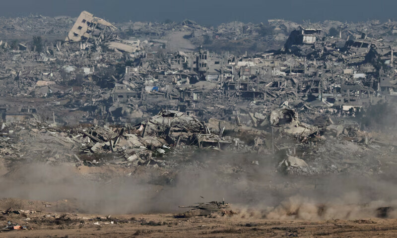 An Israeli tank manoeuvres in Gaza, as seen from the Israeli side of the border. – Reuters