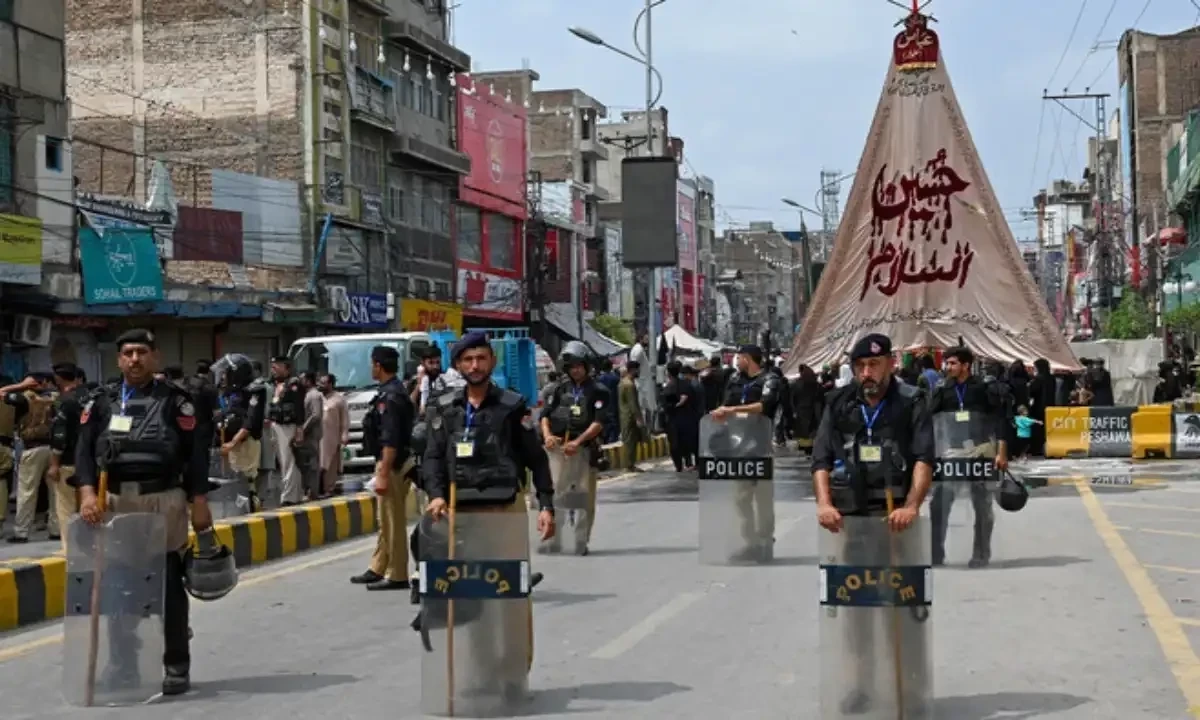 Security personnel patrol a street during a procession on the ninth day of Ashura in the Islamic month of Muharram in Peshawar on July 28, 2023, commemorating the seventh century killing of Prophet Muhammad’s (PBUH) grandson Imam Hussein. AFP/File