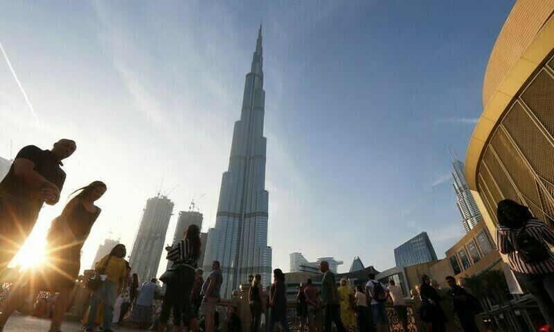 People standing in front of Burj Khalifa, worlds tallest building. Source: Reuters People standing in front of Burj Khalifa, worlds tallest building. Source: Reuters