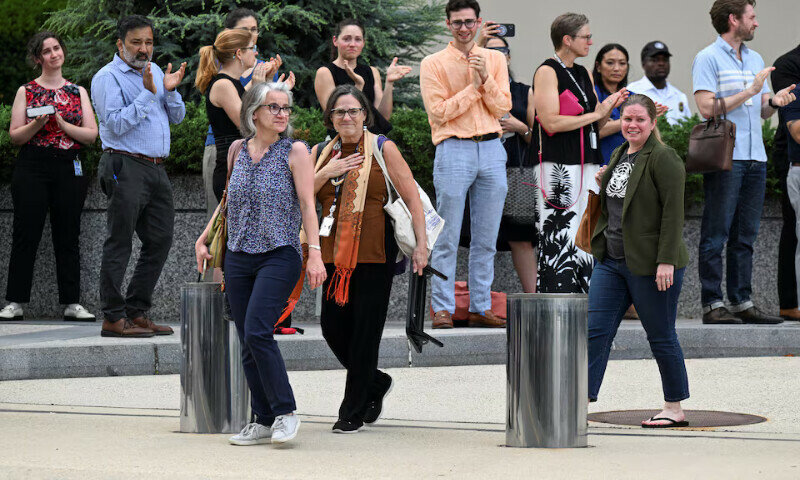 US State Department workers react as people clap during a sendoff event in Washington, DC. – Reuters US State Department workers react as people clap during a sendoff event in Washington, DC. – Reuters