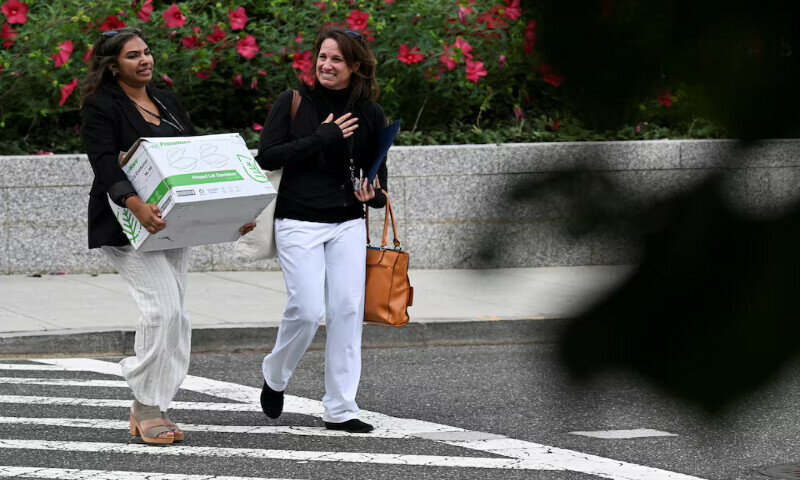 A US State Department worker carries a box with belongings, during a sendoff event in Washington, DC. – Reuters A US State Department worker carries a box with belongings, during a sendoff event in Washington, DC. – Reuters