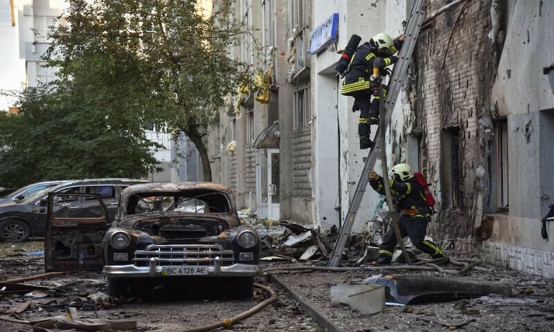 Firefighters work at the site of buildings damaged during Russian drone and missile strikes in Lviv, Ukraine, on Saturday. – Reuters