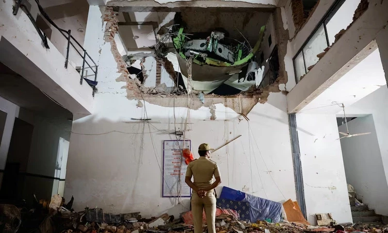 A police officer stands in front of the wreckage of an Air India aircraft, bound for London’s Gatwick Airport, which crashed during take-off from an airport in Ahmedabad, India June 12, 2025. REUTERS A police officer stands in front of the wreckage of an Air India aircraft, bound for London’s Gatwick Airport, which crashed during take-off from an airport in Ahmedabad, India June 12, 2025. REUTERS