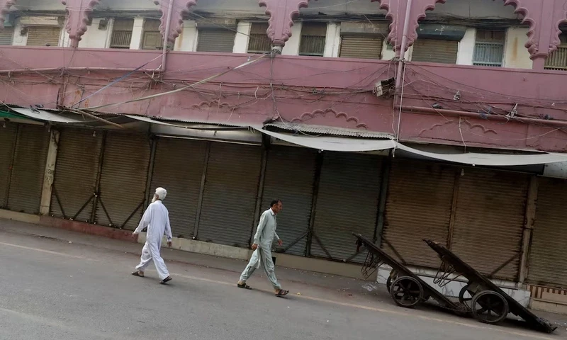 Men walk along closed market, during a shutter down and wheel-jam strike called by the traders and the religious and political party Jamaat-e-Islami (JI), against the hikes in power billings, in Karachi, Pakistan September 2, 2023. REUTERS