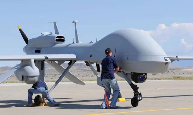 Workers prepare an MQ-1C Gray Eagle unmanned aerial vehicle for static display at Michael Army Airfield, Dugway Proving Ground in Utah in this September 15, 2011 US Army handout photo obtained by Reuters February 6, 2013. REUTERS Workers prepare an MQ-1C Gray Eagle unmanned aerial vehicle for static display at Michael Army Airfield, Dugway Proving Ground in Utah in this September 15, 2011 US Army handout photo obtained by Reuters February 6, 2013. REUTERS