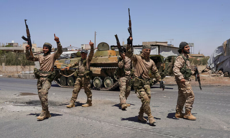 Syrian security forces walk together along a street in the southern Druze city of Sweida early on Wednesday. – Reuters Syrian security forces walk together along a street in the southern Druze city of Sweida early on Wednesday. – Reuters