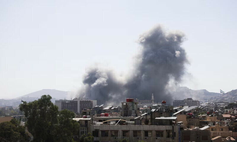 Smoke rises from a building after strikes at Syria’s defence ministry in Damascus on Wednesday. – Reuters Smoke rises from a building after strikes at Syria’s defence ministry in Damascus on Wednesday. – Reuters