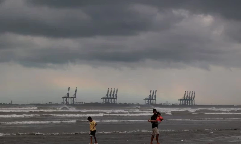 Children play, with the rainbow and rain clouds in the background, as according to the Pakistan Meteorological Department a potential cyclonic storm could develop over the Arabian Sea, at Clifton Beach in Karachi, Pakistan August 30, 2024. REUTERS Children play, with the rainbow and rain clouds in the background, as according to the Pakistan Meteorological Department a potential cyclonic storm could develop over the Arabian Sea, at Clifton Beach in Karachi, Pakistan August 30, 2024. REUTERS