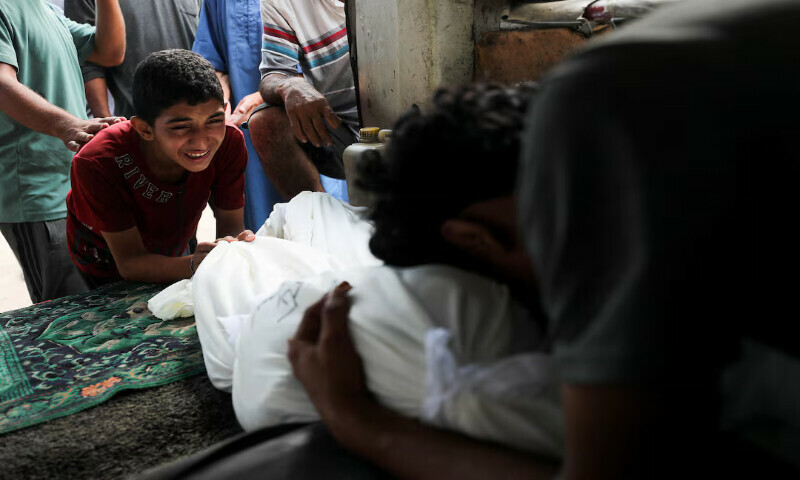 Mourners react next to a body during the funeral of Palestinians killed in an Israeli strike at Al Shifa Hospital in Gaza City on Saturday. – Reuters Mourners react next to a body during the funeral of Palestinians killed in an Israeli strike at Al Shifa Hospital in Gaza City on Saturday. – Reuters