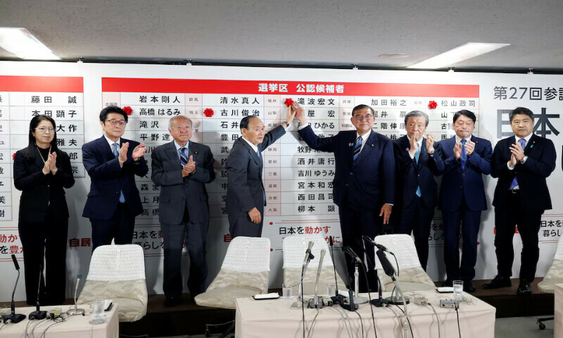 Shigeru Ishiba, Japanese Prime Minister and president of the ruling Liberal Democratic Party (LDP), and party officials place a red paper rose on the name of an elected candidate at the LDP headquarters in Tokyo, Japan, on Sunday. – Reuters Shigeru Ishiba, Japanese Prime Minister and president of the ruling Liberal Democratic Party (LDP), and party officials place a red paper rose on the name of an elected candidate at the LDP headquarters in Tokyo, Japan, on Sunday. – Reuters