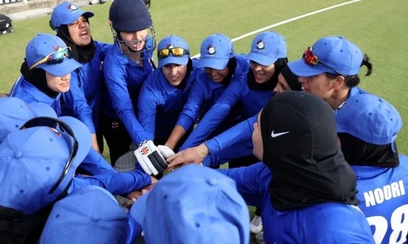 Afghanistan Women’s XI players huddle before the cricket match between Afghanistan Women’s XI and Cricket Without Borders XI at Junction Oval in Melbourne on January 30, 2025. — AFP