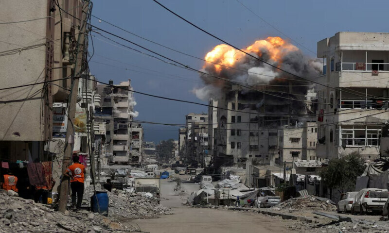 Smoke and flames rise from a residential building hit by an Israeli strike, in Gaza City July 21, 2025. REUTERS Smoke and flames rise from a residential building hit by an Israeli strike, in Gaza City July 21, 2025. REUTERS