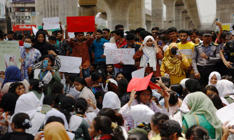 Students hold placards as they protest in Dhaka, Bangladesh, on Tuesday after an air force training aircraft crashed into a building. – Reuters Students hold placards as they protest in Dhaka, Bangladesh, on Tuesday after an air force training aircraft crashed into a building. – Reuters