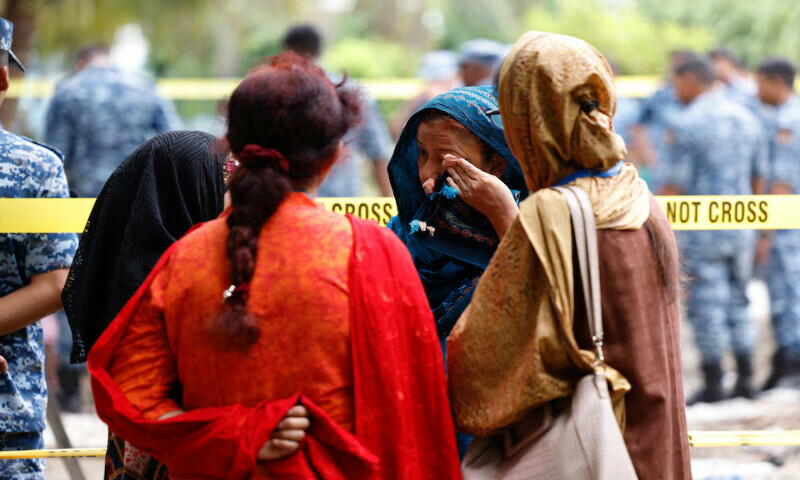 Women react at the site of the plane crash in Dhaka, Bangladesh, on Tuesday. – Reuters Women react at the site of the plane crash in Dhaka, Bangladesh, on Tuesday. – Reuters