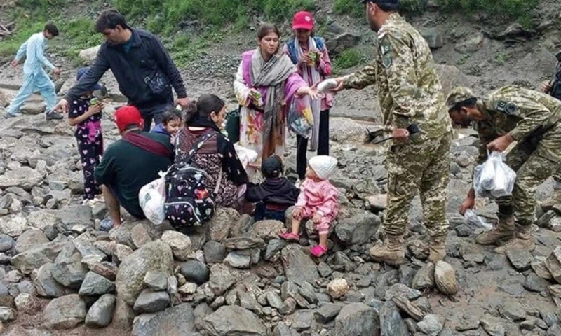 This handout photograph released on July 22, 2025 by Government of Gilgit-Baltistan shows Pakistan’s army soldiers helping visitors to evacuate the landslide hit area in Babusar, G-B. Photo: AFP This handout photograph released on July 22, 2025 by Government of Gilgit-Baltistan shows Pakistan’s army soldiers helping visitors to evacuate the landslide hit area in Babusar, G-B. Photo: AFP