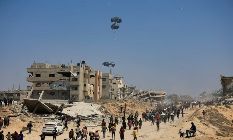 Humanitarian aid is airdropped over Gaza as seen from the northern Gaza Strip on Sunday. – Reuters
