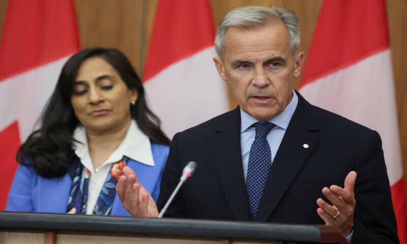Canada’s Prime Minister Mark Carney speaks at a press conference while Foreign Affairs Minister Anita Anand listens in Ottawa, Ontario, Canada. – Reuters