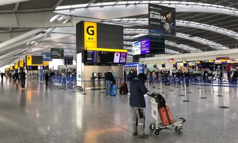 Passengers are seen at BA check-in desks at Heathrow Airport, following the outbreak of the coronavirus disease (COVID-19), London, Britain January 15, 2021. REUTERS