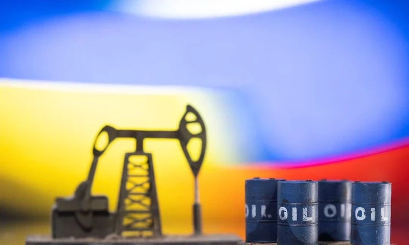 Models of oil barrels and a pump jack are displayed in front of Ukrainian and Russian flag colors in this illustration taken, February 24, 2022. REUTERS Models of oil barrels and a pump jack are displayed in front of Ukrainian and Russian flag colors in this illustration taken, February 24, 2022. REUTERS