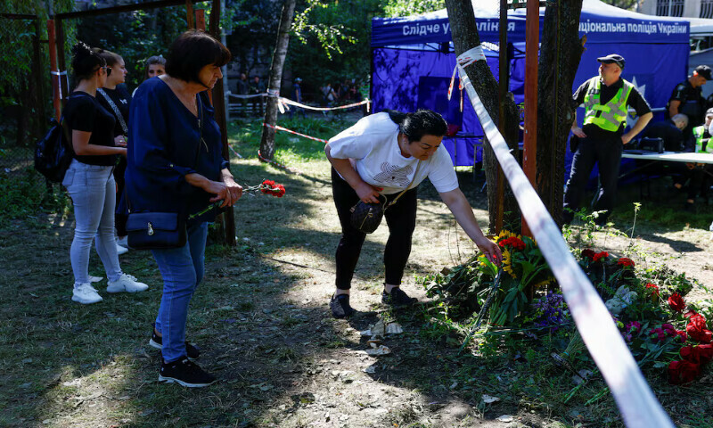 Residents place flowers in memory of victims at the site of an apartment building that was hit by a Russian missile strike in Kyiv, Ukraine. – Reuters Residents place flowers in memory of victims at the site of an apartment building that was hit by a Russian missile strike in Kyiv, Ukraine. – Reuters
