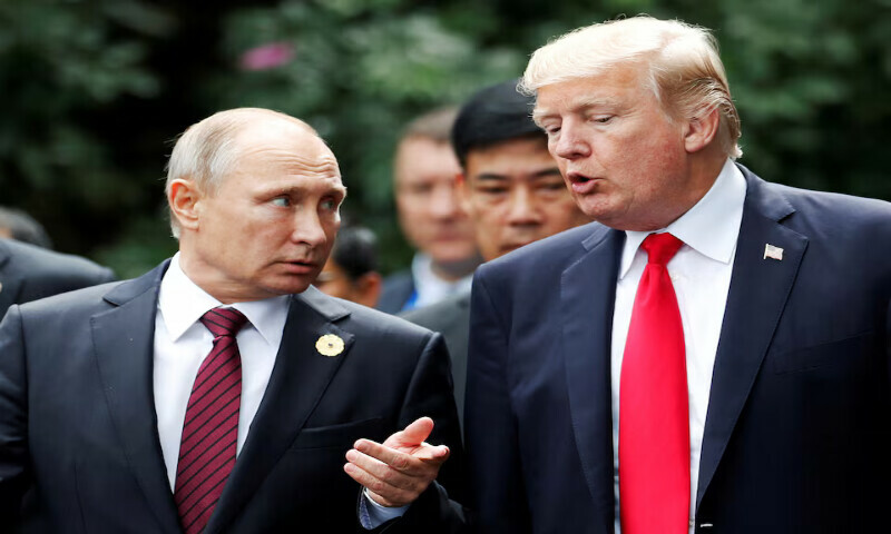 US President Donald Trump and Russia’s President Vladimir Putin talk during the family photo session at the APEC Summit in Danang, Vietnam. – Reuters file US President Donald Trump and Russia’s President Vladimir Putin talk during the family photo session at the APEC Summit in Danang, Vietnam. – Reuters file