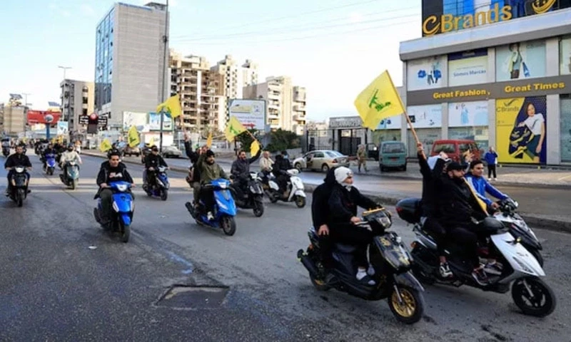 Men carry Hezbollah flags while riding on two wheelers, at the entrance of Beirut’s southern suburbs, in Lebanon, November 27, 2024. — Reuters Men carry Hezbollah flags while riding on two wheelers, at the entrance of Beirut’s southern suburbs, in Lebanon, November 27, 2024. — Reuters