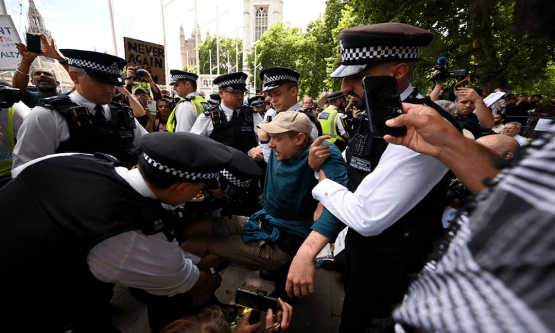 Police officers detain a demonstrator during a rally organised by Defend Our Juries, challenging the British government’s proscription of ‘Palestine Action’ under anti-terrorism laws, in Parliament Square, in London, on August 9, 2025. Reuters Police officers detain a demonstrator during a rally organised by Defend Our Juries, challenging the British government’s proscription of ‘Palestine Action’ under anti-terrorism laws, in Parliament Square, in London, on August 9, 2025. Reuters