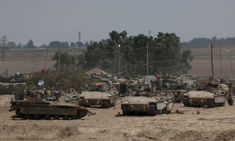 Israeli military vehicles stand near the border between Israel and Gaza. – Reuters Israeli military vehicles stand near the border between Israel and Gaza. – Reuters