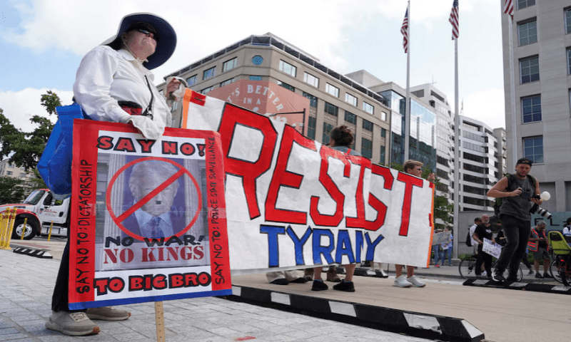Protesters hold a banner near the White House, as US President Donald Trump announced he is placing the DC Metropolitan Police Department under direct federal control and deploying National Guard troops to Washington, DC, in Washington DC, on August 11, 2025. Reuters Protesters hold a banner near the White House, as US President Donald Trump announced he is placing the DC Metropolitan Police Department under direct federal control and deploying National Guard troops to Washington, DC, in Washington DC, on August 11, 2025. Reuters