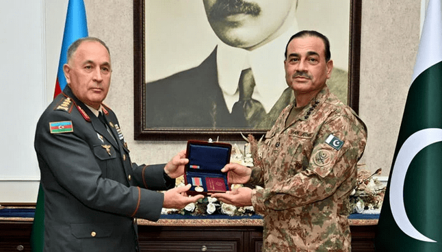 Field Marshal Asim Munir (right) receives the ‘Patriotic War Medal’ from Azerbaijan’s Chief of General Staff, Colonel General Karim Valiyev, during a meeting at the General Headquarters (GHQ) in Rawalpindi. Field Marshal Asim Munir (right) receives the ‘Patriotic War Medal’ from Azerbaijan’s Chief of General Staff, Colonel General Karim Valiyev, during a meeting at the General Headquarters (GHQ) in Rawalpindi.