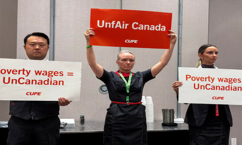 Union activists hold placards, as they interrupt a press conference by Air Canada executives, ahead of a potential strike by Air Canada flight attendants, at a hotel in Toronto, Ontario, Canada. – Reuters Union activists hold placards, as they interrupt a press conference by Air Canada executives, ahead of a potential strike by Air Canada flight attendants, at a hotel in Toronto, Ontario, Canada. – Reuters
