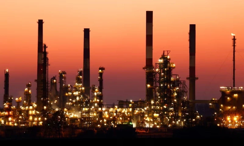 The chimneys of the Total Grandpuits oil refinery are seen just after sunset, southeast of Paris, France, March 1, 2021. REUTERS The chimneys of the Total Grandpuits oil refinery are seen just after sunset, southeast of Paris, France, March 1, 2021. REUTERS